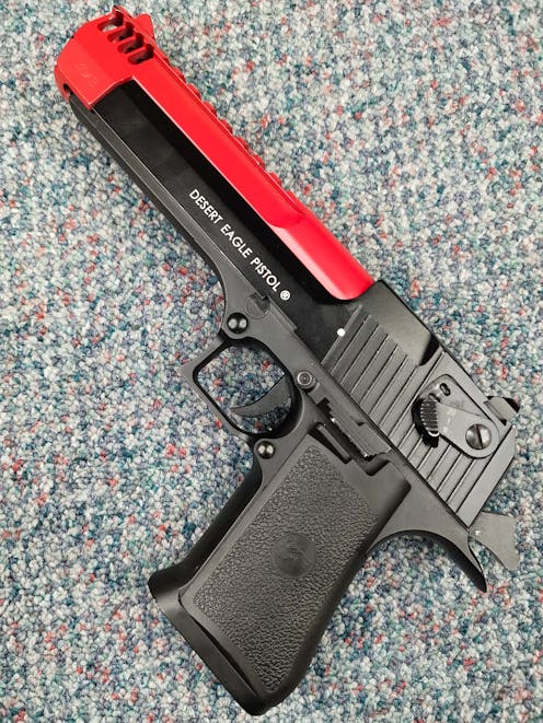 Cybergun BY-104443 Desert Eagle .50AE CO2 GBB Pistol; FULL AUTO; Black; PTT Red