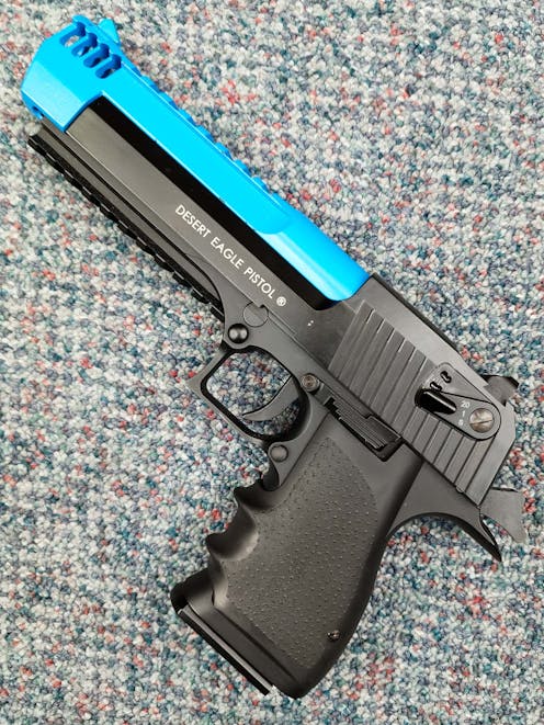 Cybergun BY-104447 Desert Eagle L6 .50AE CO2 GBB Pistol; FULL AUTO; Black; PTT Blue