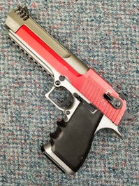 Cybergun BY-104449 Desert Eagle L6 .50AE CO2 GBB Pistol; FULL AUTO; Stainless Steel; PTT Red