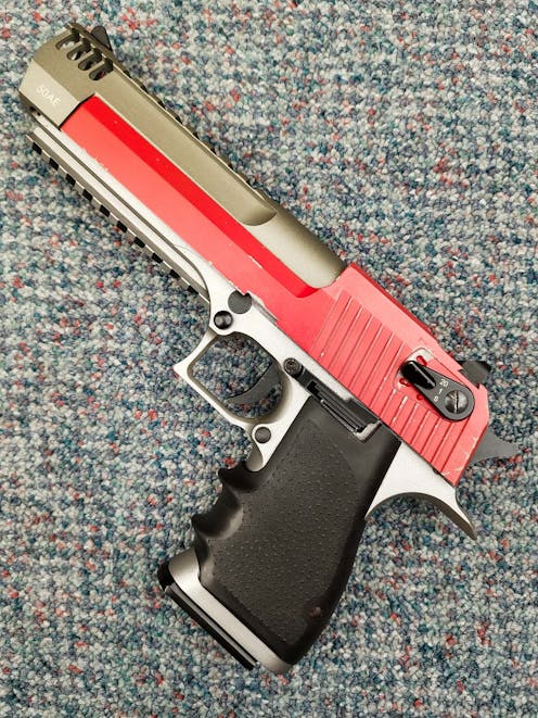 Cybergun BY-104449 Desert Eagle L6 .50AE CO2 GBB Pistol; FULL AUTO; Stainless Steel; PTT Red