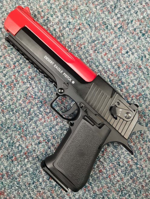 Cybergun BY-104453 Desert Eagle .50AE Railed CO2 GBB Pistol; FULL AUTO; Black; PTT Red
