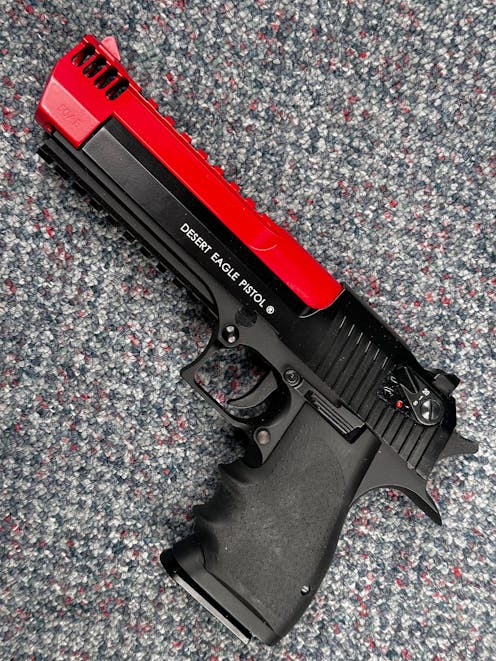Cybergun BY-104307 Desert Eagle L6 .50AE CO2 GBB Pistol; FULL AUTO; Black; PTT Red