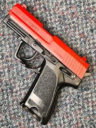 Umarex BY-103084 H&K USP Compact Spring Operated Airsoft Pistol; PTT Red
