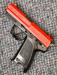 Umarex BY-103079 H&K USP Compact Spring Operated Airsoft Pistol; PTT Red