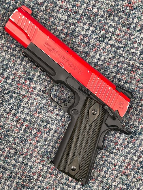 Cybergun BY-104904 Rail Gun Series Colt 1911 CO2 Blowback Pistol; Black/Silver; PTT Red