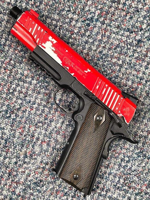 Cybergun BY-104796 Rail Gun Series Colt 1911 CO2 Blowback Pistol; Black / Silver; PTT Red